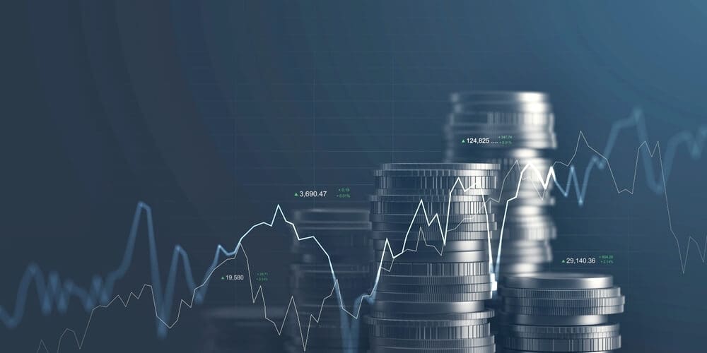 pilhas de moedas com gráficos financeiros, conceito de criação de moedas digitais e tokens com a tecnologia blockchain